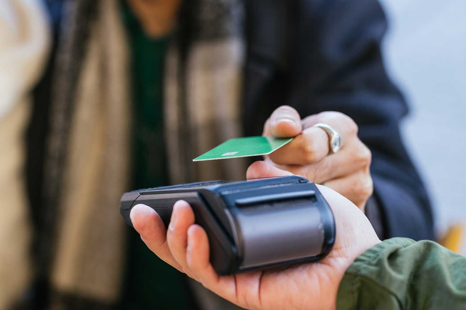 Close-up shot of someone making a contactless payment