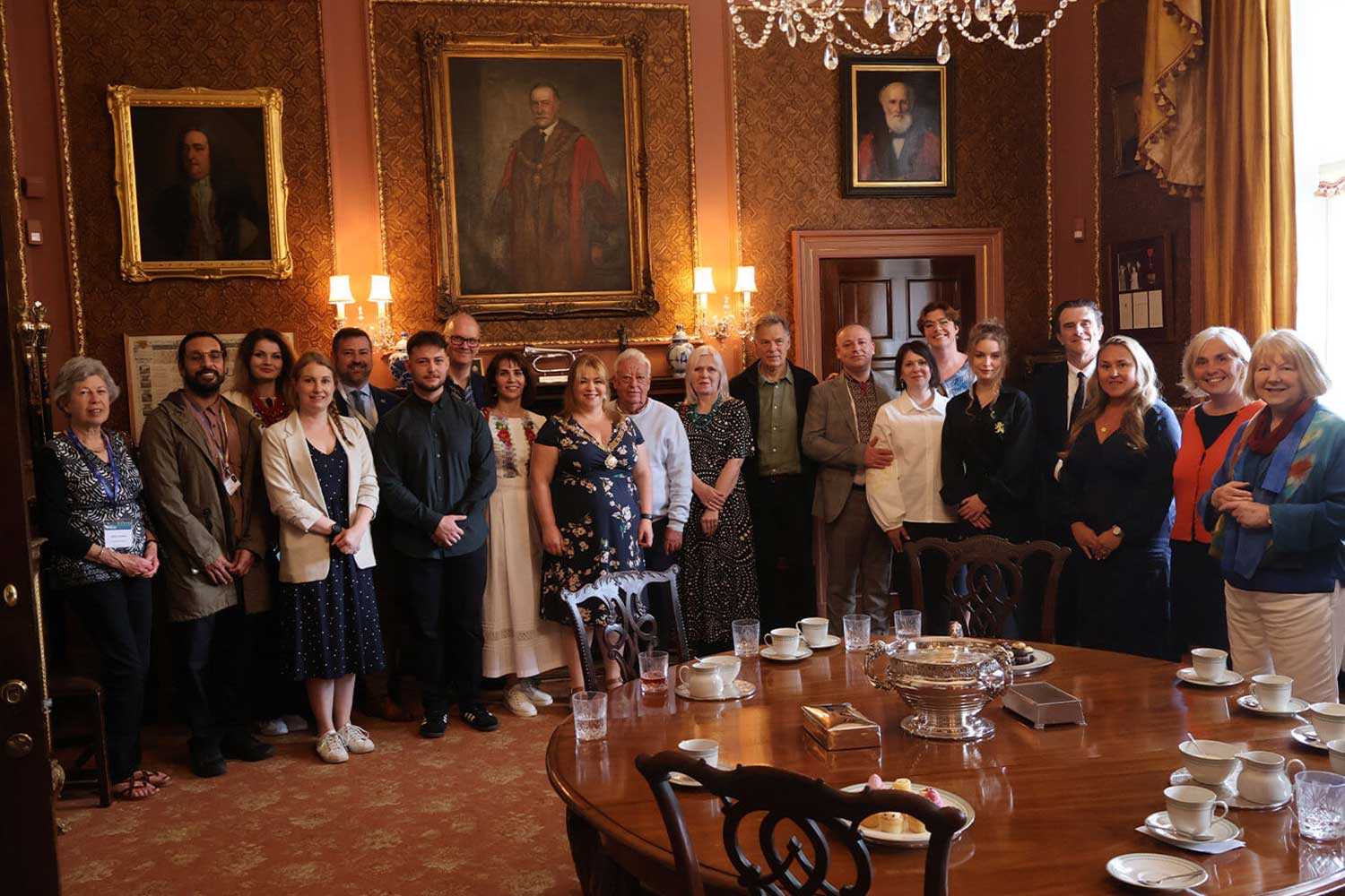 Delegates gather in an ornate room in the Guildhall in Bath