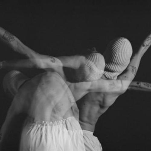 A black and white artistic photo of a person moving in front of the camera