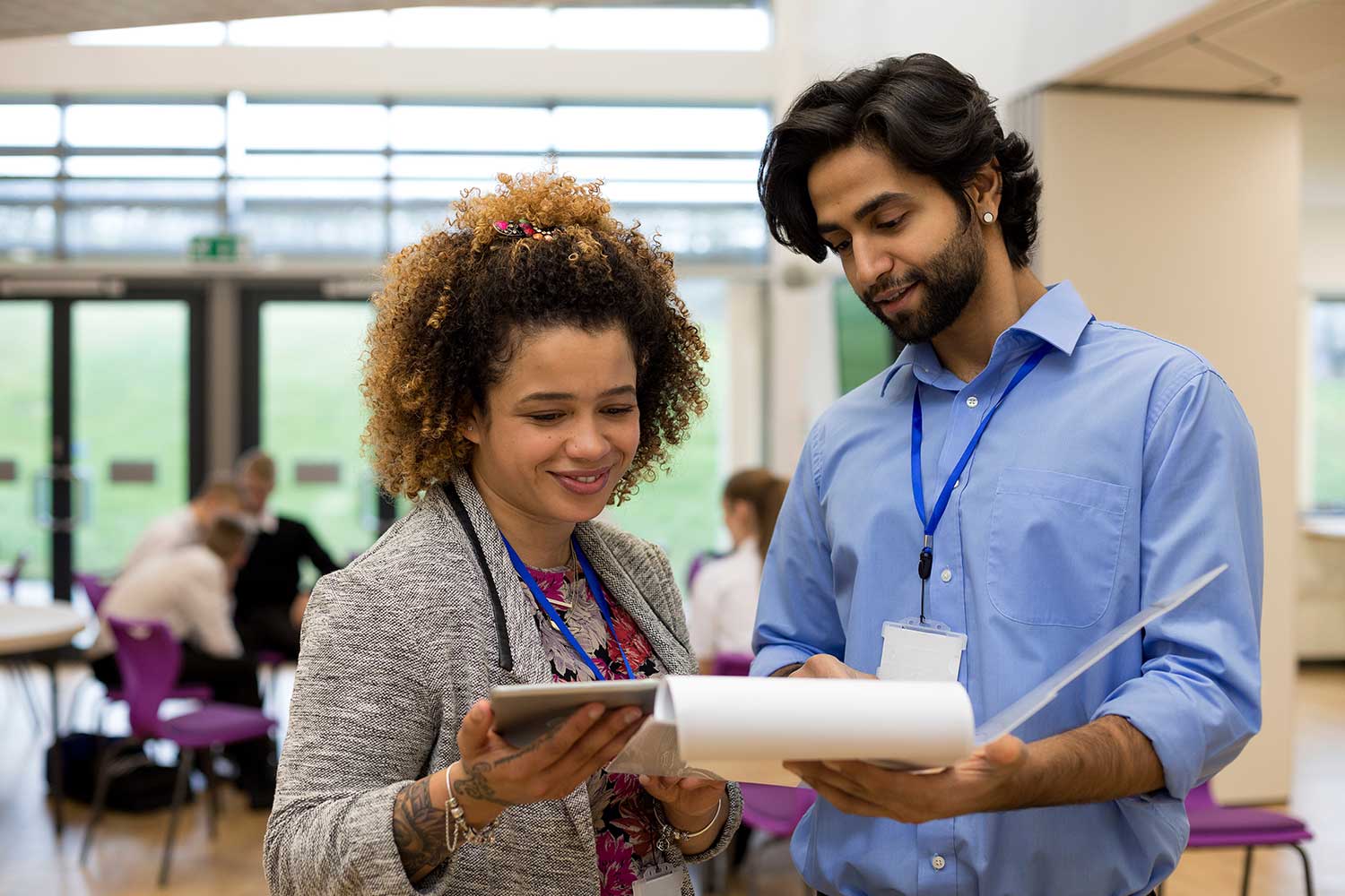 Two members of teaching staff compare notes