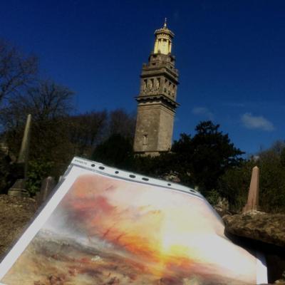 Scene of a historic tower with a photo infront