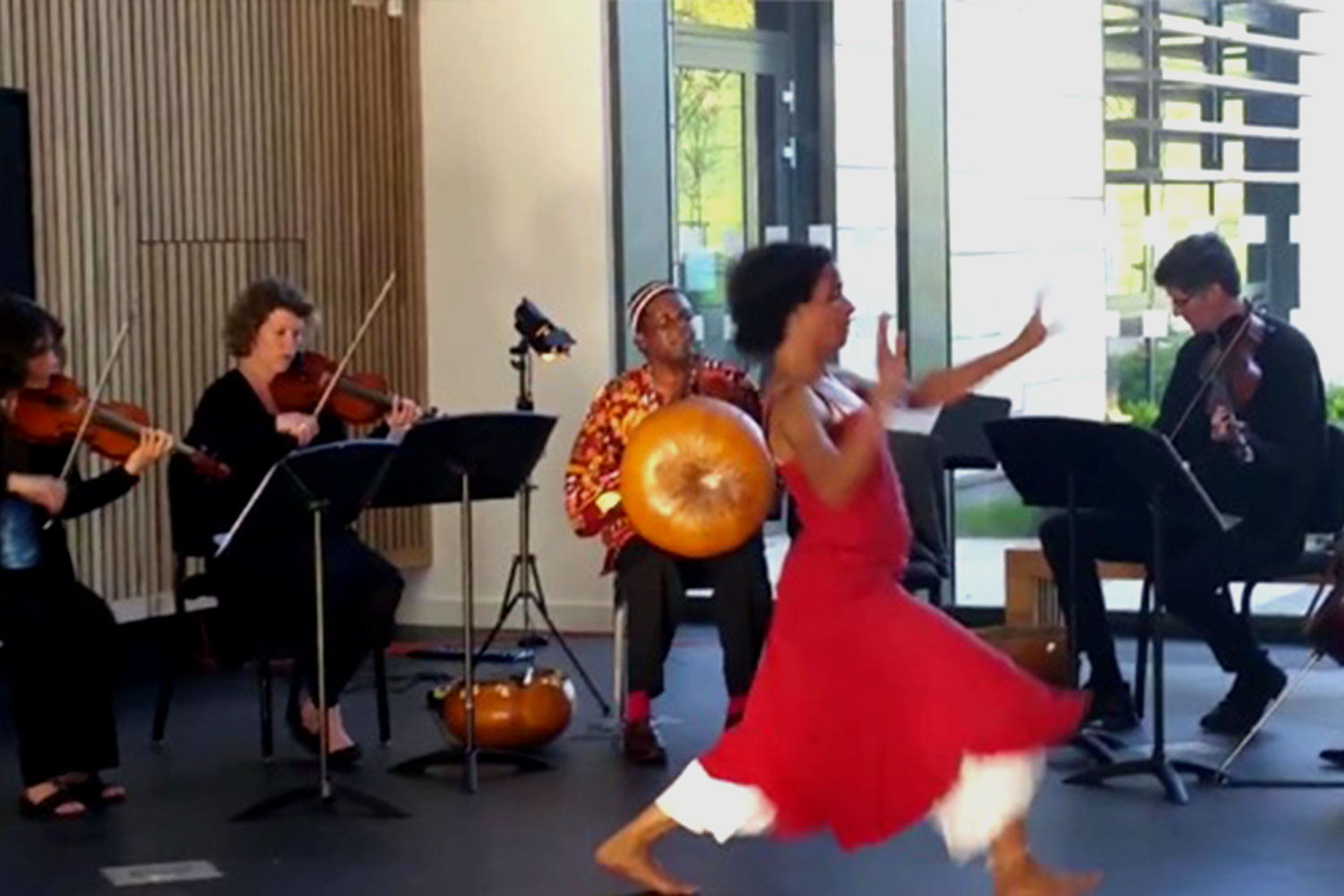 Musicians and a dancer in Commons atrium