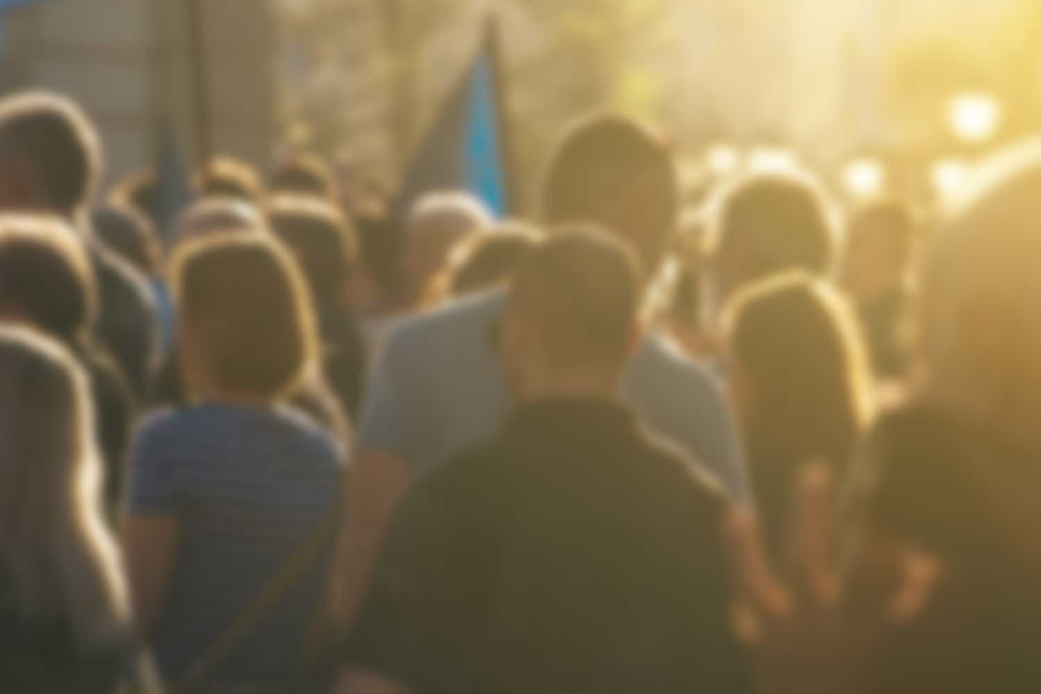A blurred photo of an unidentifiable crowd