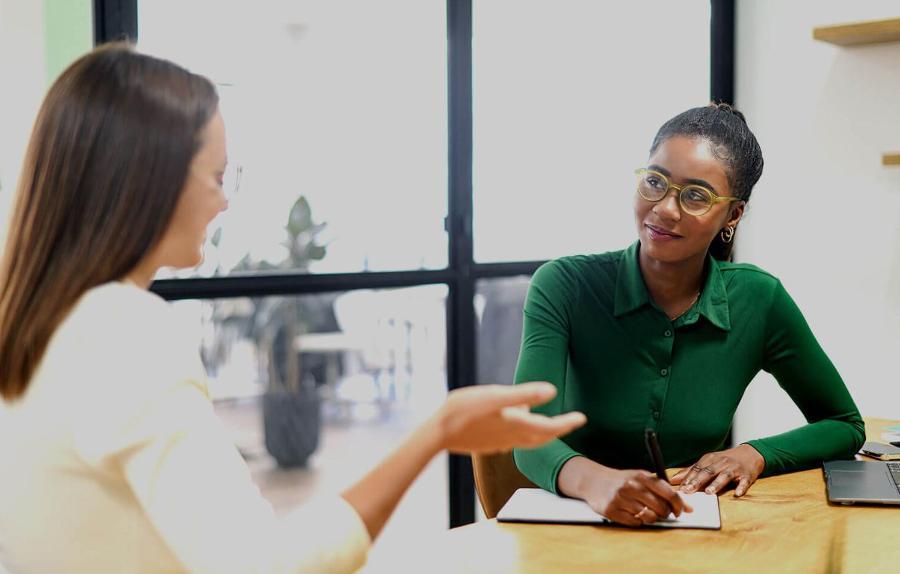 Business women shaking hands in the office during business meeting