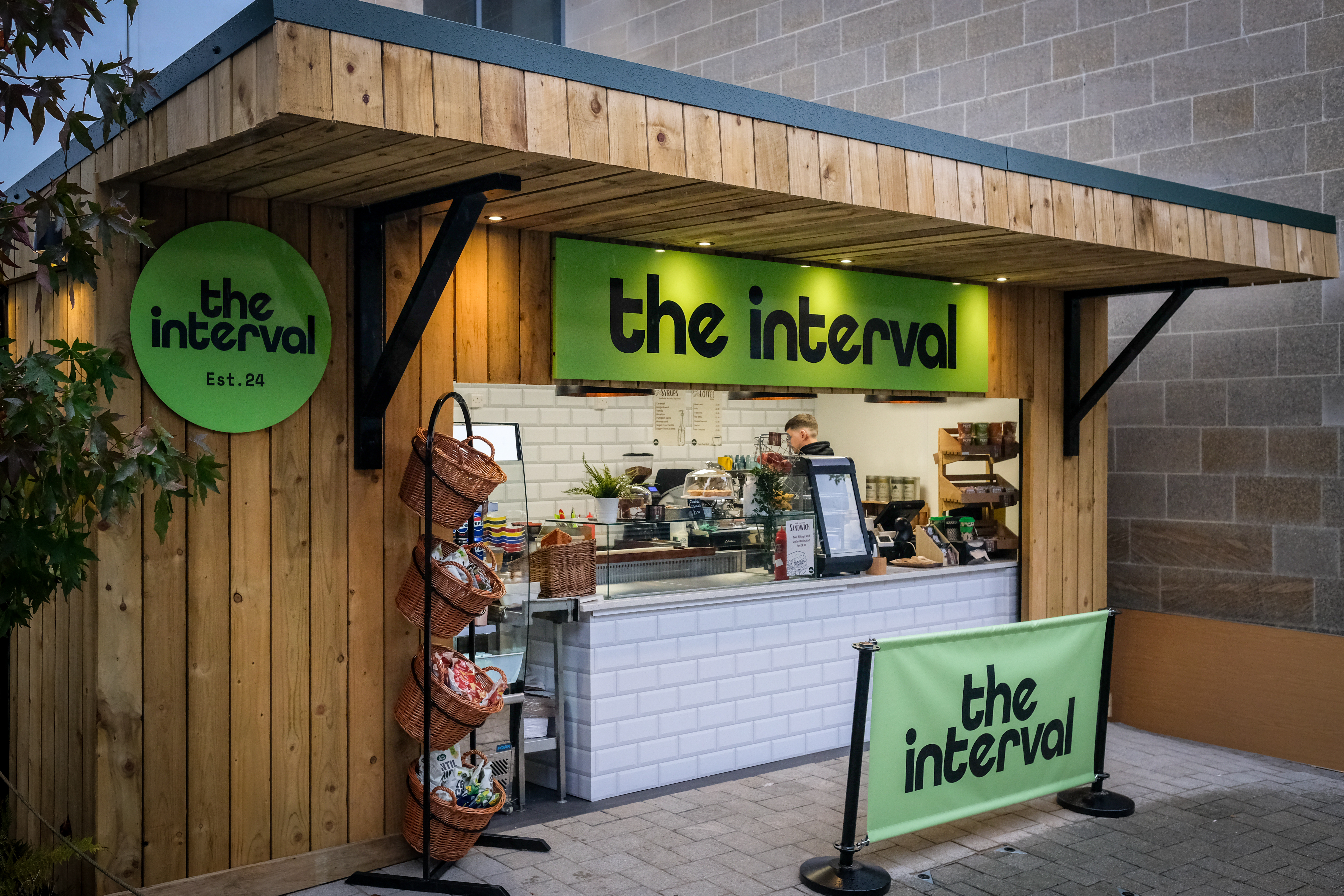 An outdoor coffee shop serving hot drinks and sandwiches