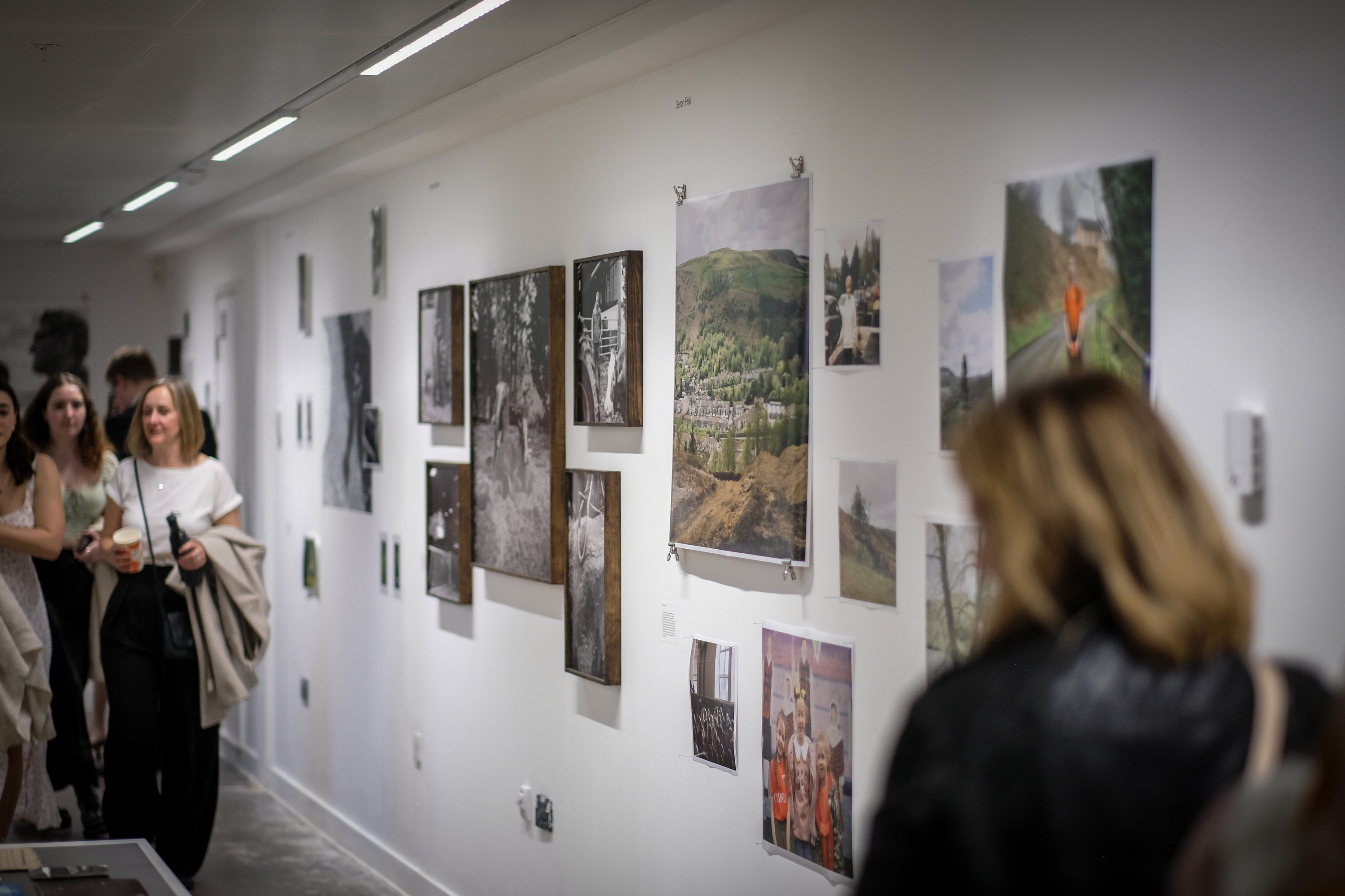 People milling around an art gallery