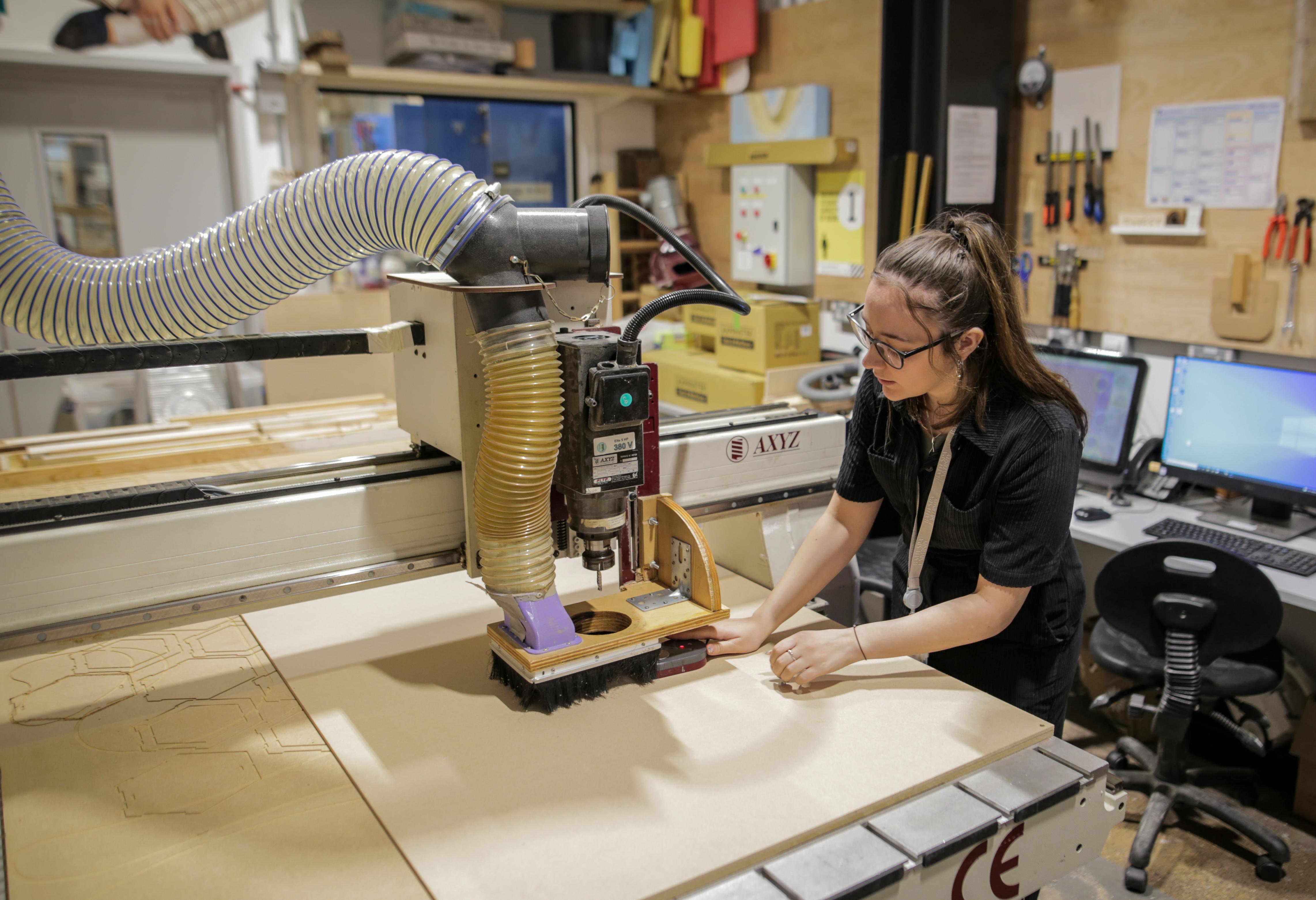 A student working in the furniture and product design studios