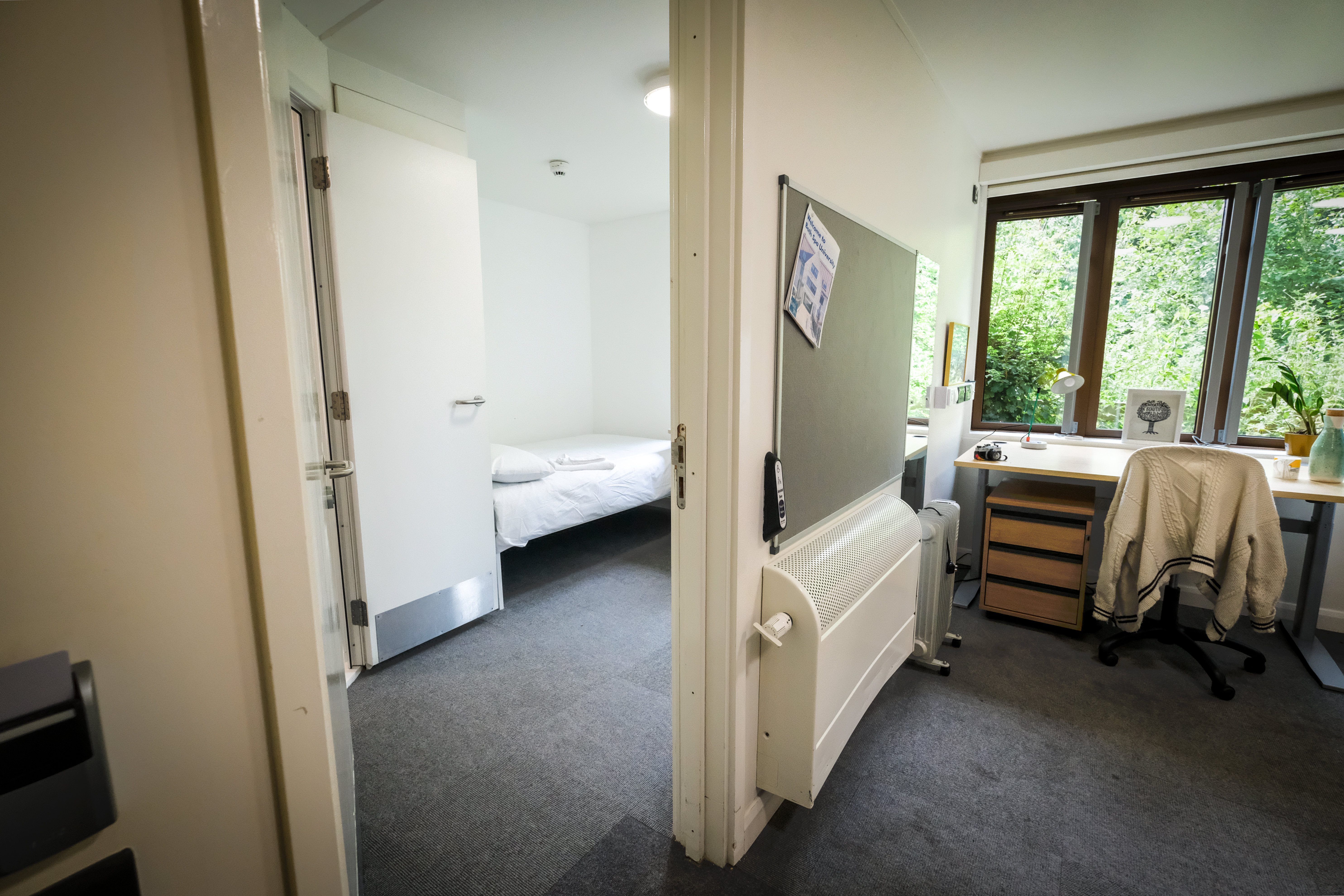 Two adjoined bedrooms with a door between them