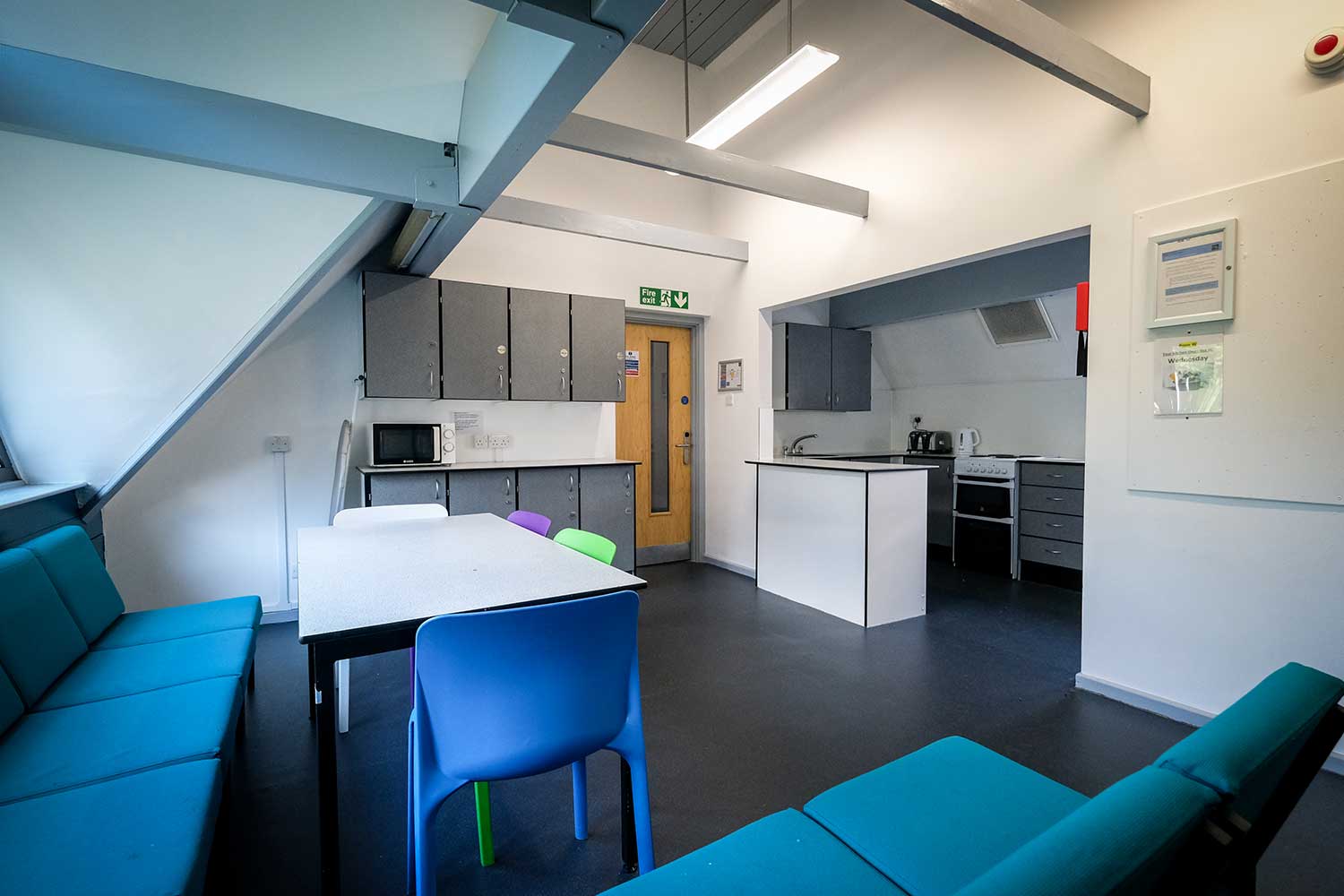 A large communal seating area in a student kitchen