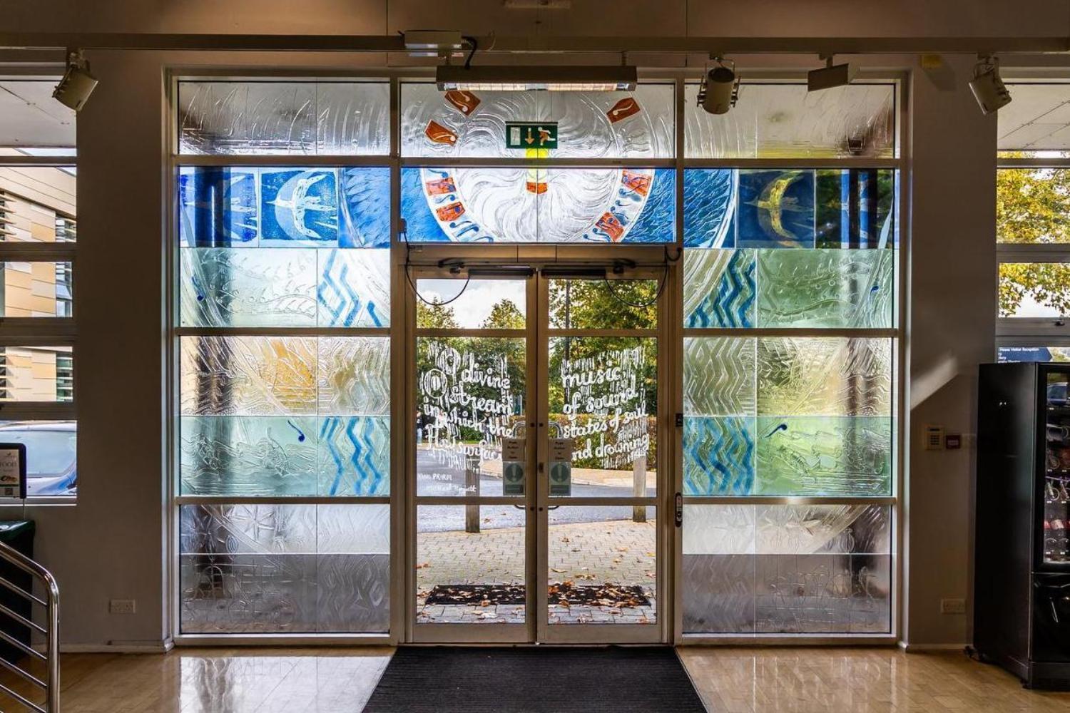 Double doors with colourful stained glass patterns