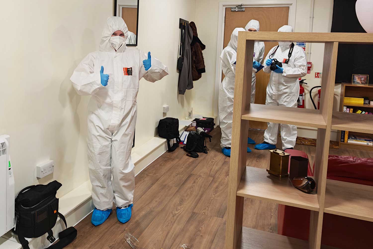 Students in full PPE stand in the Crime Scene Lab