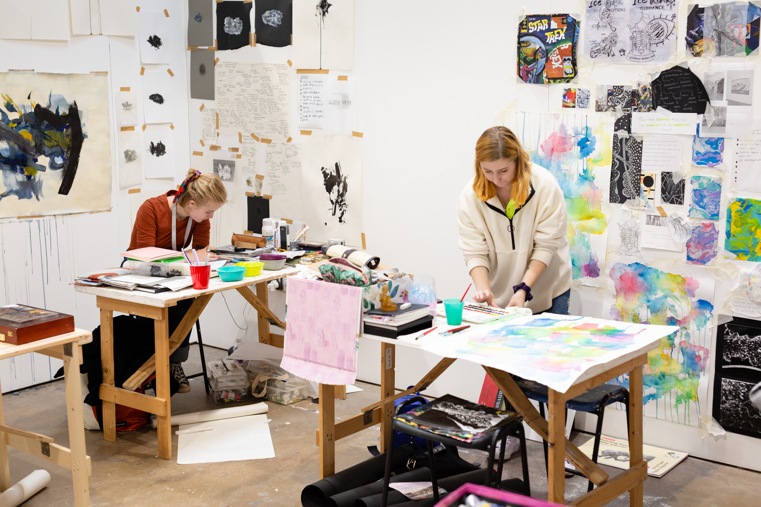 Two artists working in their dedicated studios