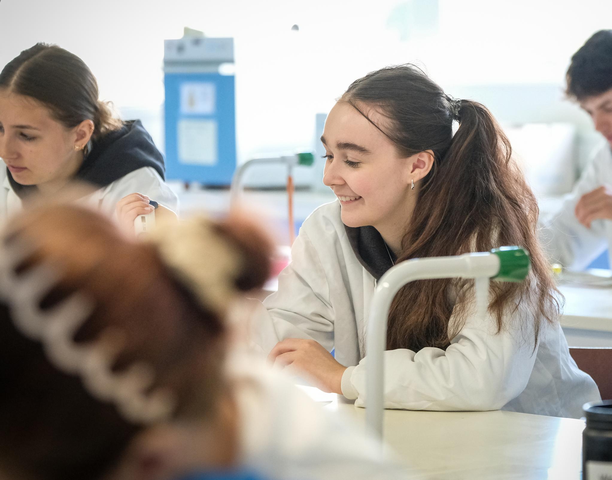 Students sitting at benches in a science lab