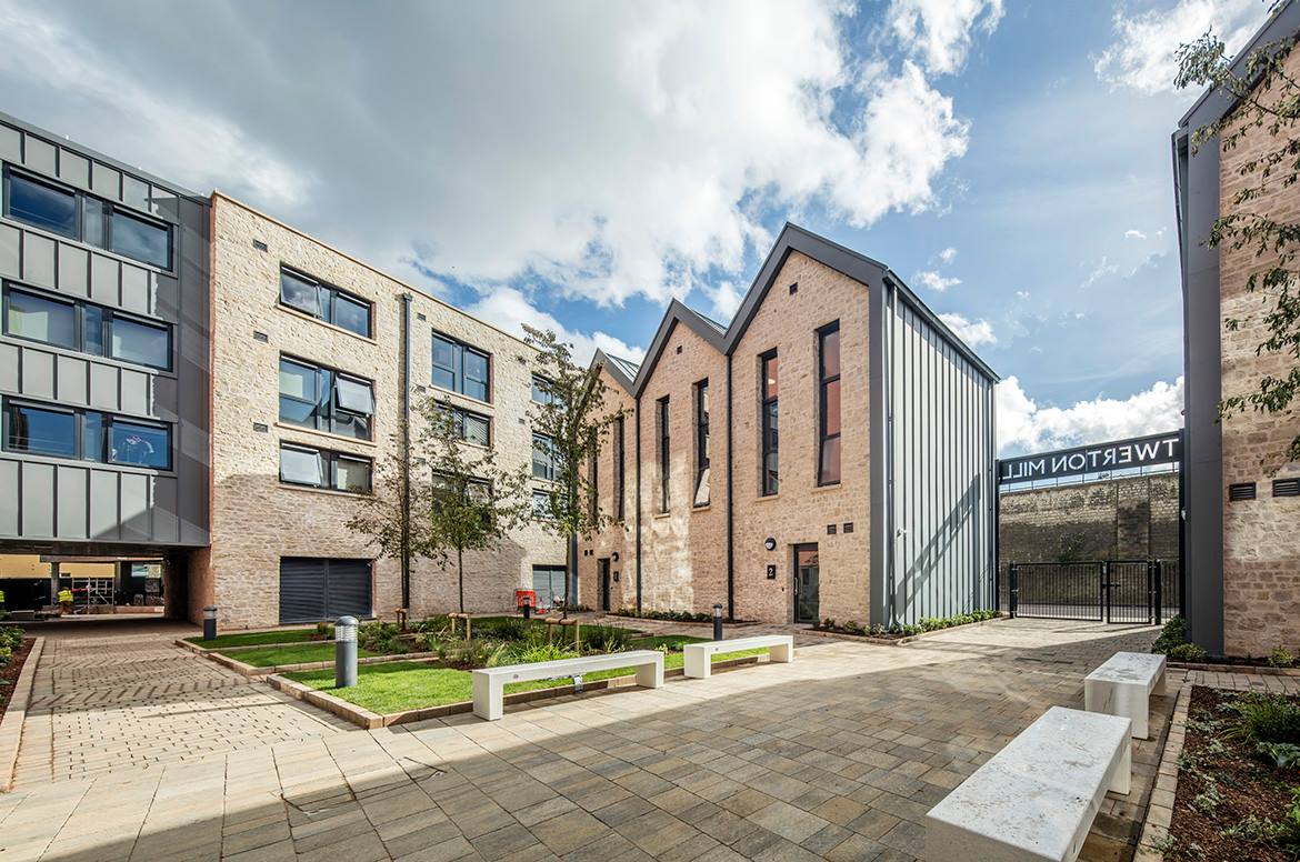 A modern building with several entrances and lots of windows
