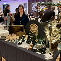 A Bath Spa University student sells from a stall.