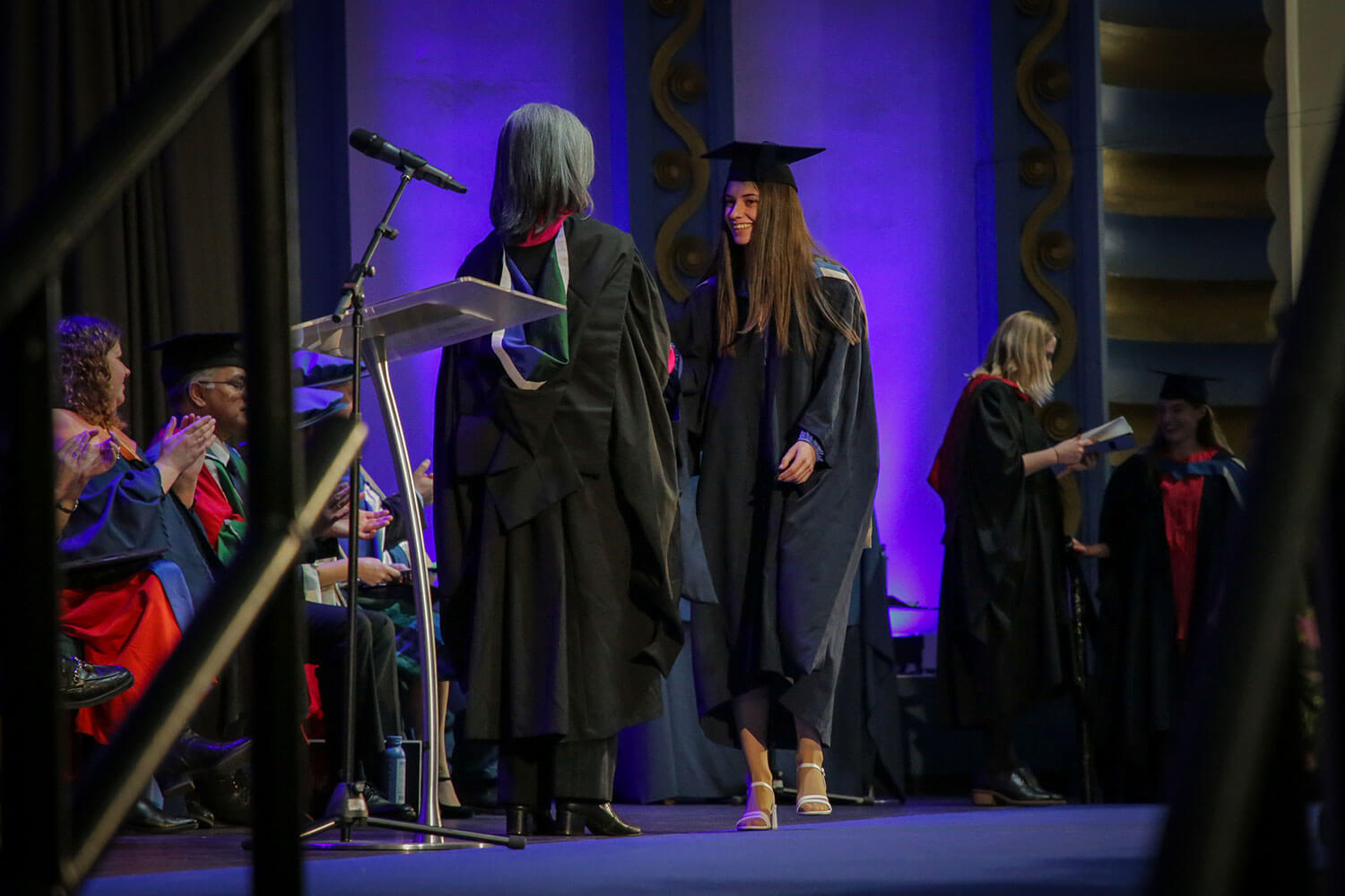 Graduand shakes hands with the Chancellor