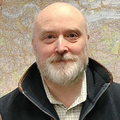 Man with white beard smiling